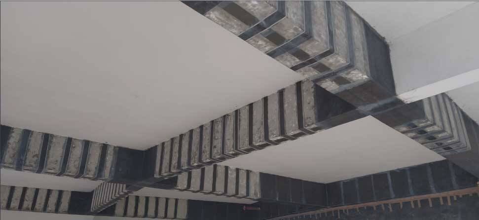 installation of Fiber Laminates and Carbon Fiber Wraps bonded onto the RC Beams installation of Fiber Laminates and Carbon Fiber Wraps bonded onto the RC Beams