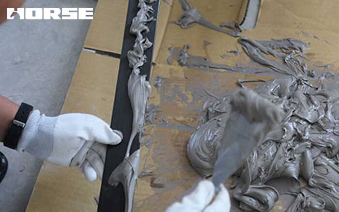 appling adhesive on carbon fiber laminate appling adhesive on carbon fiber laminate