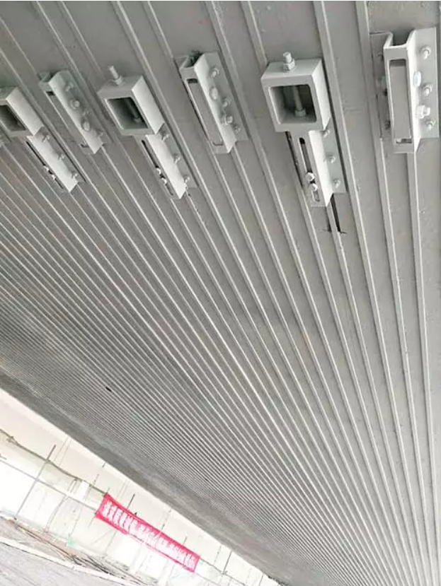 Prestressed Carbon Fiber Laminate Reinforcement System Prestressed Carbon Fiber Laminate Reinforcement System